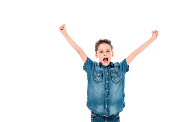 front view of excited child in denim clothes waving hands and screaming isolated on white - Photo, image
