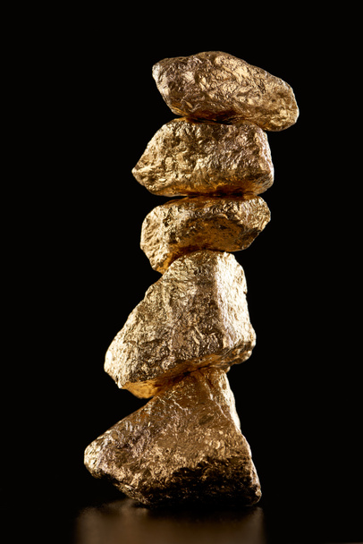 five golden textured shiny stones isolated on black - Фото, зображення