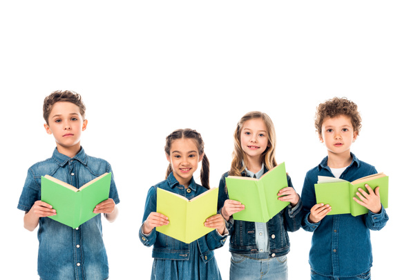four kids in denim clothes holding books isolated on white - Fotó, kép