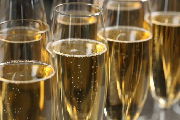 Many glasses of champagne as background, closeup view - Фото, зображення