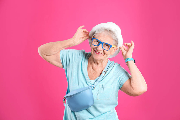 Portrait of cool grandmother on color background - Foto, Bild