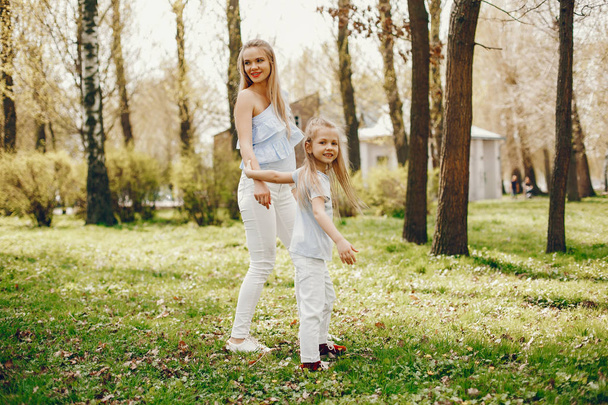 elegant mother with cute daughter  - Valokuva, kuva