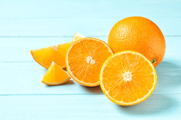 Fresh oranges on wooden background. Healthy fruits - Foto, imagen