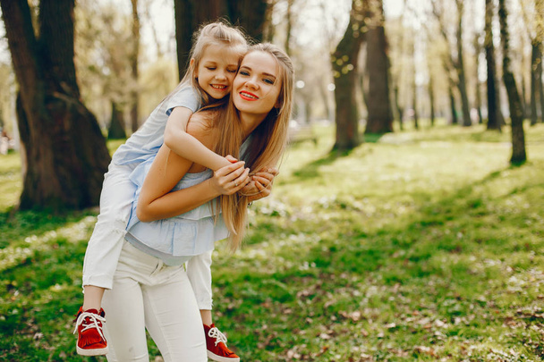 elegant mother with cute daughter  - Foto, afbeelding