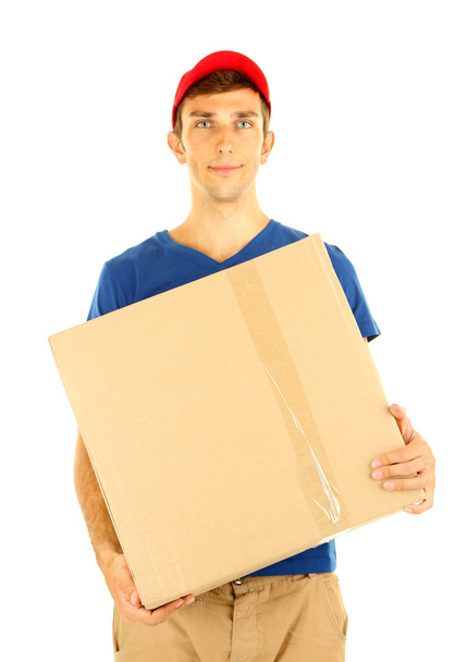 Young delivery man holding parcel, isolated on white - Valokuva, kuva
