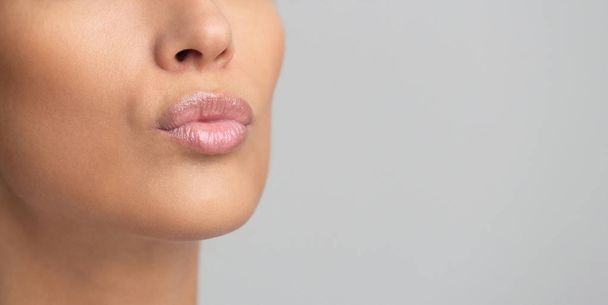 Cosmetics and makeup. Lips with pink gloss - Fotografie, Obrázek