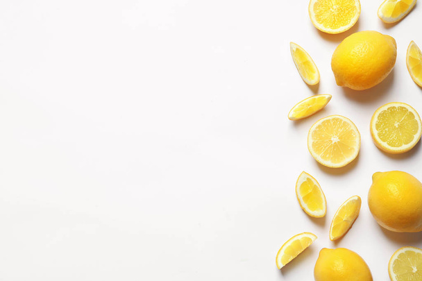 Fresh lemons on white background, top view. Citrus fruits - 写真・画像