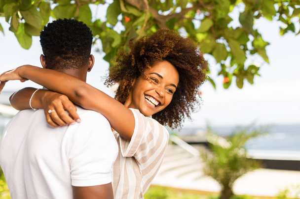 Outdoor protrait of black african american couple embracing each - Фото, зображення