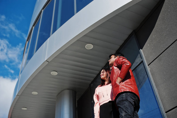 Asian couple standing together against new modern building and l - Foto, Bild