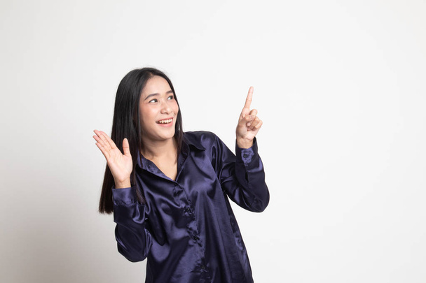 Excited Asian woman point to blank space. - 写真・画像