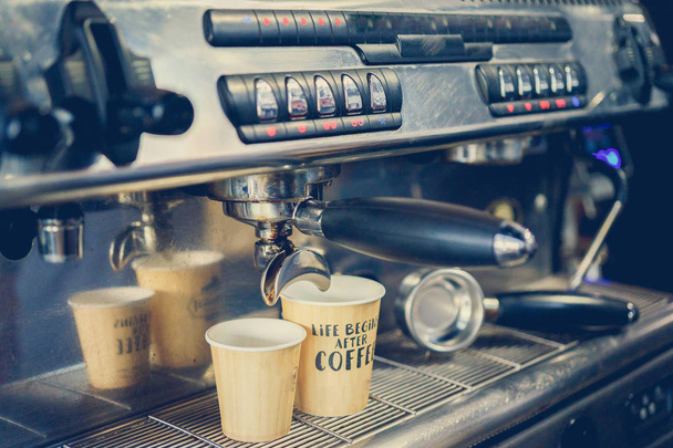 coffee is prepared in a coffee machine - Фото, изображение