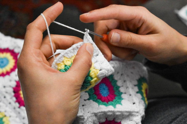 Female hands knitting with colorful wool - Photo, Image