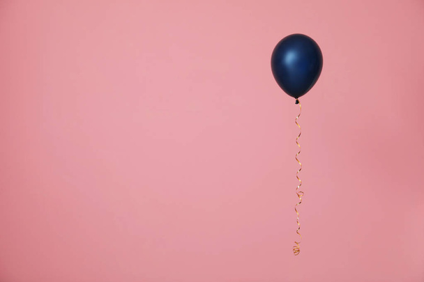Bright balloon on color background, space for text. Celebration time - Valokuva, kuva