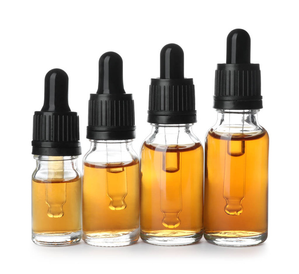 Bottles of essential oil isolated on white - Φωτογραφία, εικόνα