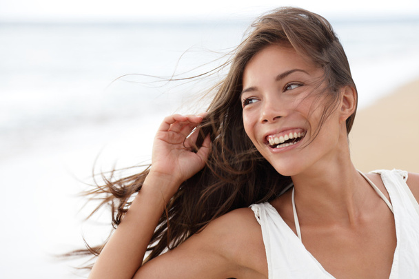 Happy girl on beach - candid young woman joyful - Фото, зображення