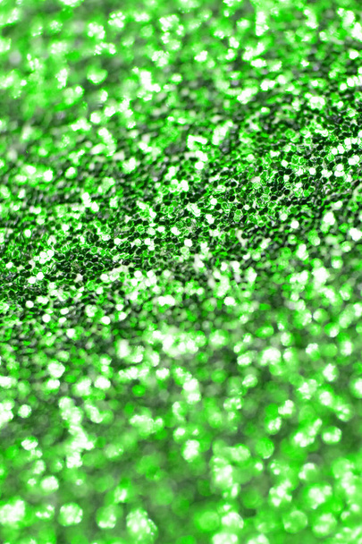 Close-up van groene glitter met bokeh voor achtergrond - Foto, afbeelding