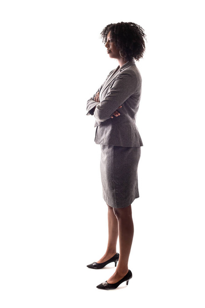 Side View of a black businesswoman or an anonymous female presidential candidate.  The person is backlit and isolated on a white background.  - Foto, afbeelding