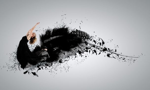Woman floating on dark wings - Photo, Image