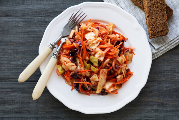 Korean salad with cabbage and carrots on a plate                                - Foto, imagen