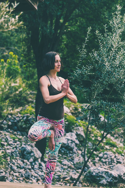 Woman doing yoga in nature. - Photo, Image