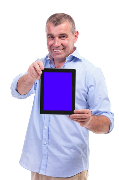 casual middle aged man shows his tablet - Фото, изображение