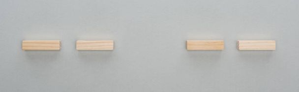 panoramic shot of wooden bricks isolated on grey - Photo, Image