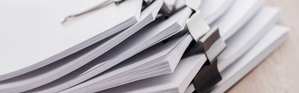 panoramic shot of stacks of blank paper with metal paper clips - Photo, Image