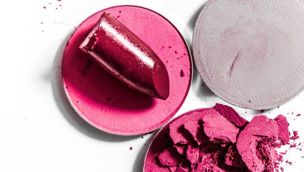 Crushed eyeshadows and lipstick isolated on white background - 写真・画像