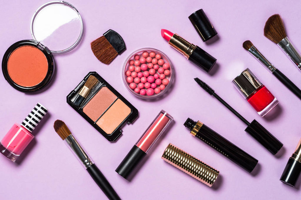 Makeup professional cosmetics on purple background.  - Photo, Image