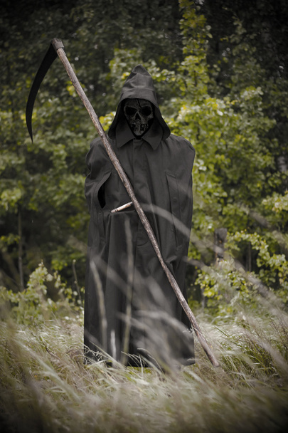Death standing with scythe on hand - Photo, Image