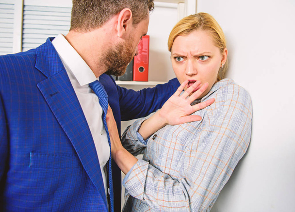 Unacceptable violent behavior. Prevalence of violence and harassment at workplace. Woman worker scared by brutal boss threatening violence. Domination concept. Girl victim office violence concept - Photo, image