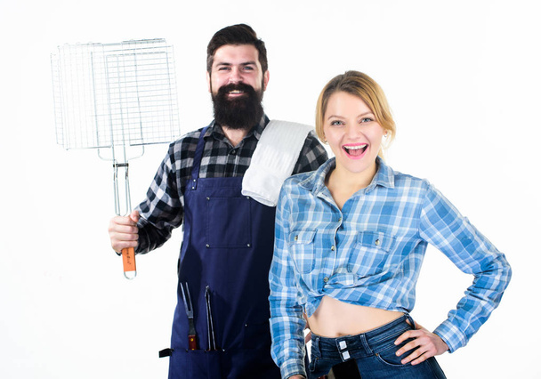 Just for fun. Picnic barbecue. food cooking recipe. Family weekend. Couple in love hold kitchen utensils. Man bearded hipster and girl. Preparation and culinary. Tools for roasting meat - Zdjęcie, obraz