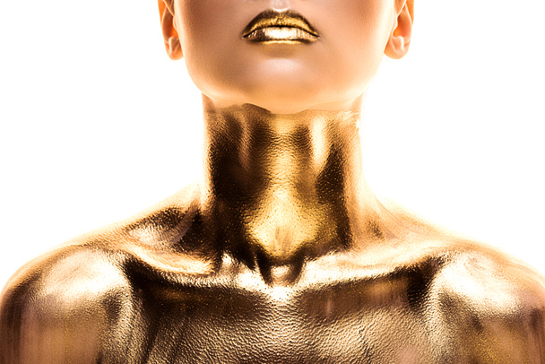részleges kilátás a meztelen nőt festett arany izolált fehér - Fotó, kép