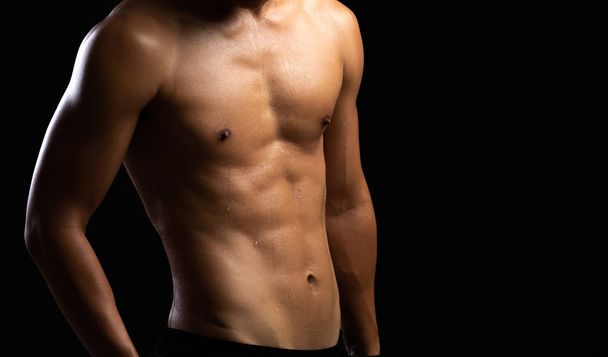 Closeup of a strength fitness body. Fit young man - Photo, Image