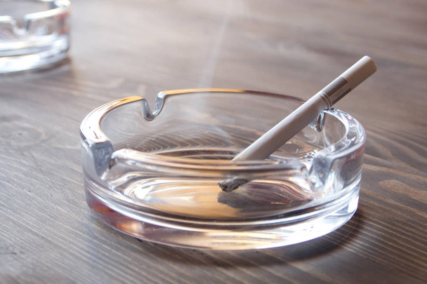 The cigarette in an ashtray - Фото, зображення