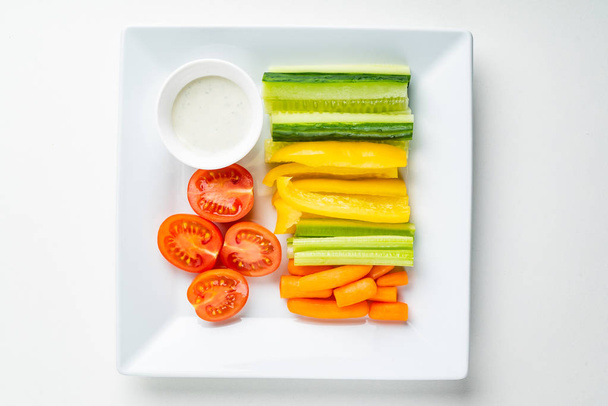 fresh organic vegetables with dip on the white background - Photo, Image