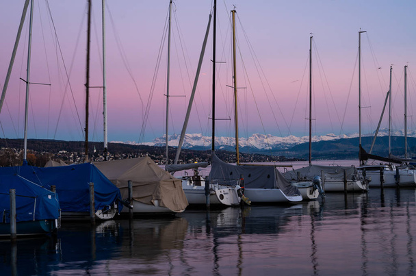 Sailing boat yacht dock pier calm water at dusk - Photo, Image