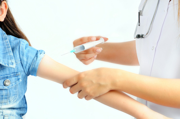 Close-up of doctor s hands giving an injection to the patient - Photo, Image