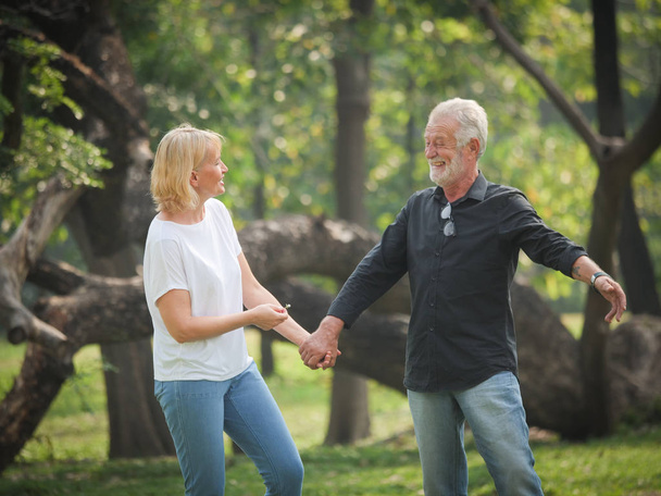 Two happy seniors retirement Man and woman are walking  and talk - Valokuva, kuva