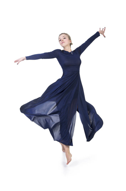 A girl in a blue dress dancing ballet. - Foto, Imagem