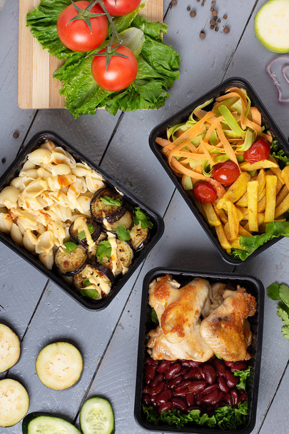 closeup of ready meal to eat in food containers, pasta and eggplants with cherry tomatoes,top view - Photo, Image