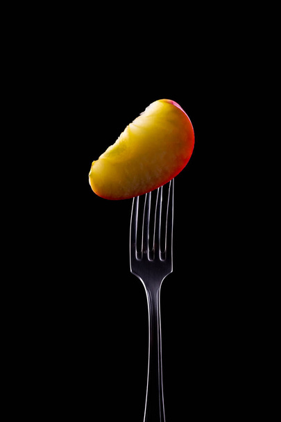 Apple on Fork with black background - Photo, Image