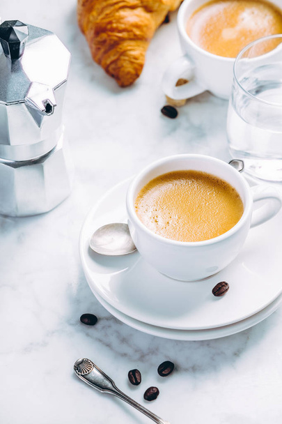 Coffee composition on white marble background. Coffee espresso in white cups - 写真・画像