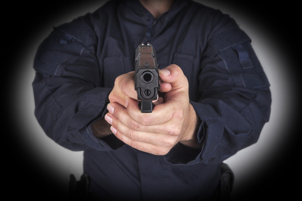 policeman with gun - Foto, imagen