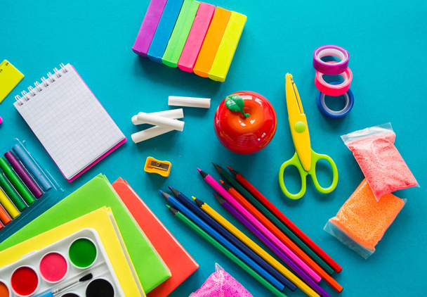 Stationery for study at school lies on blue. Back to school. Rainbow color - Photo, Image