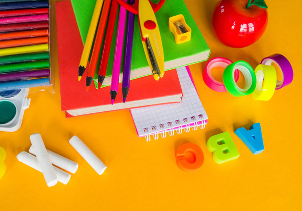 Stationery yellow background. Education. Training material for learning and creativity. - Foto, Imagen
