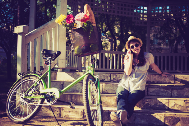Beautiful woman with bicycle - Fotó, kép