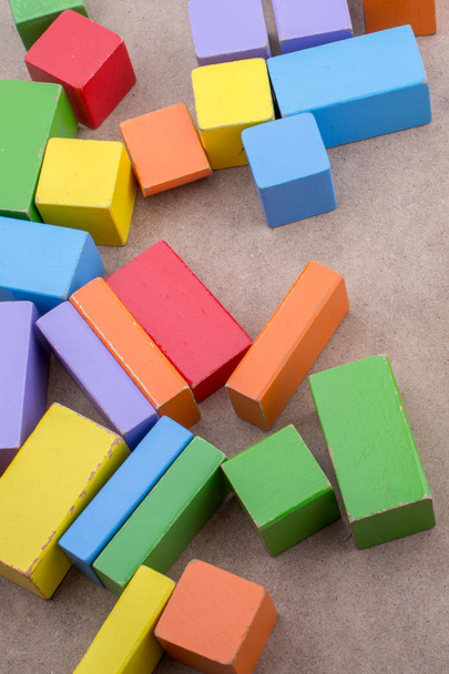 Colorful building  blocks on brown background - Photo, Image