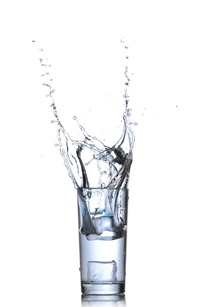 Water splashes in the glass isolated on white - Fotó, kép