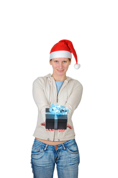 Young woman in santa's hat holding gift box isolated on white background - Photo, image